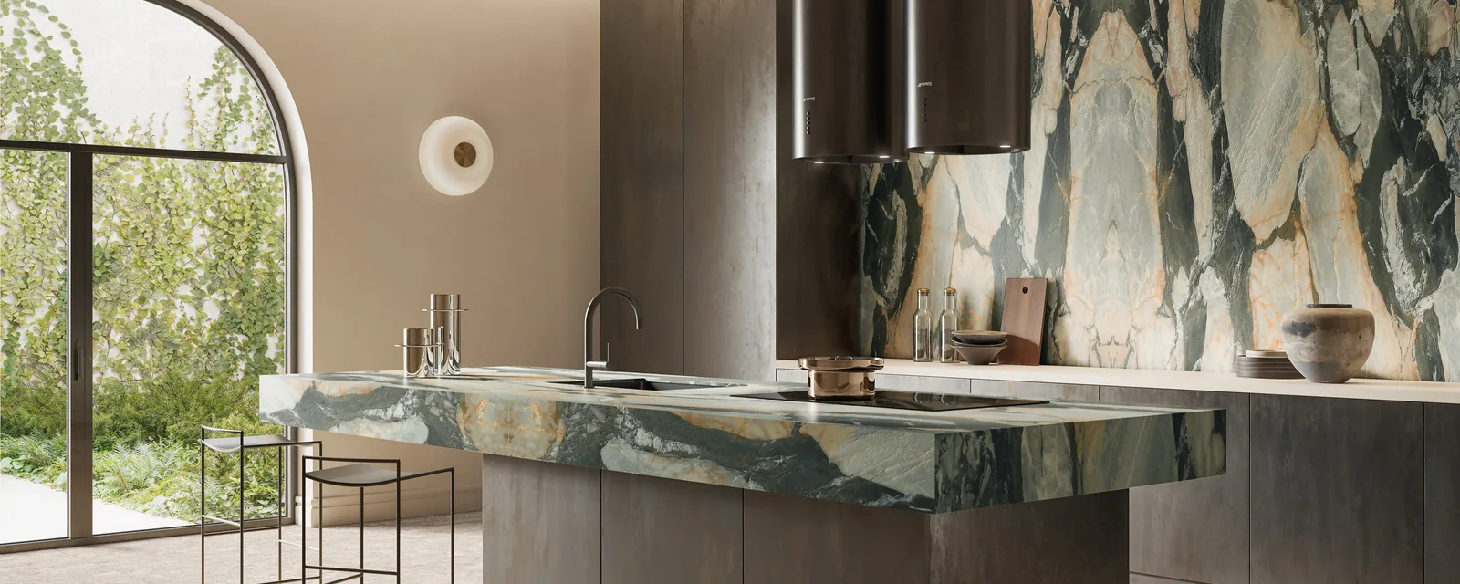 Modern kitchen with a green Bedrosians stone island and matching backsplash