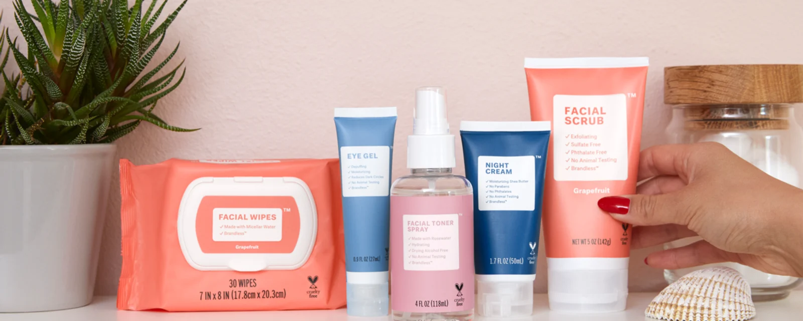 Brandless skincare line of facial wipes, eye gel, toner, night cream and scrub on a shelf