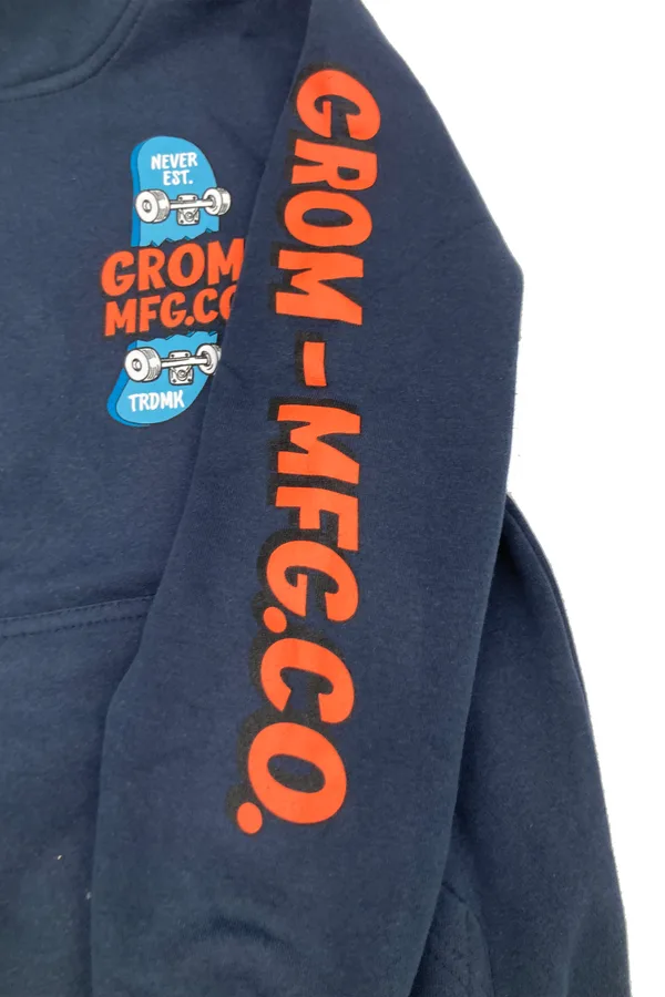 Sleeve of a navy Grom hoodie printed with GROM-MFG.CO