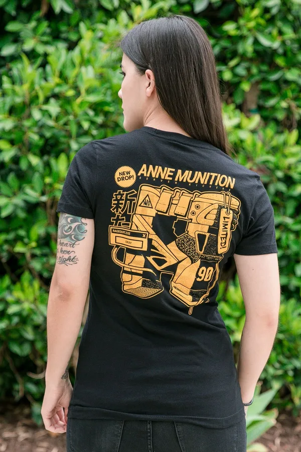 Model wearing a black Anne Munition limited-drop tee by J!NX, shown from the back