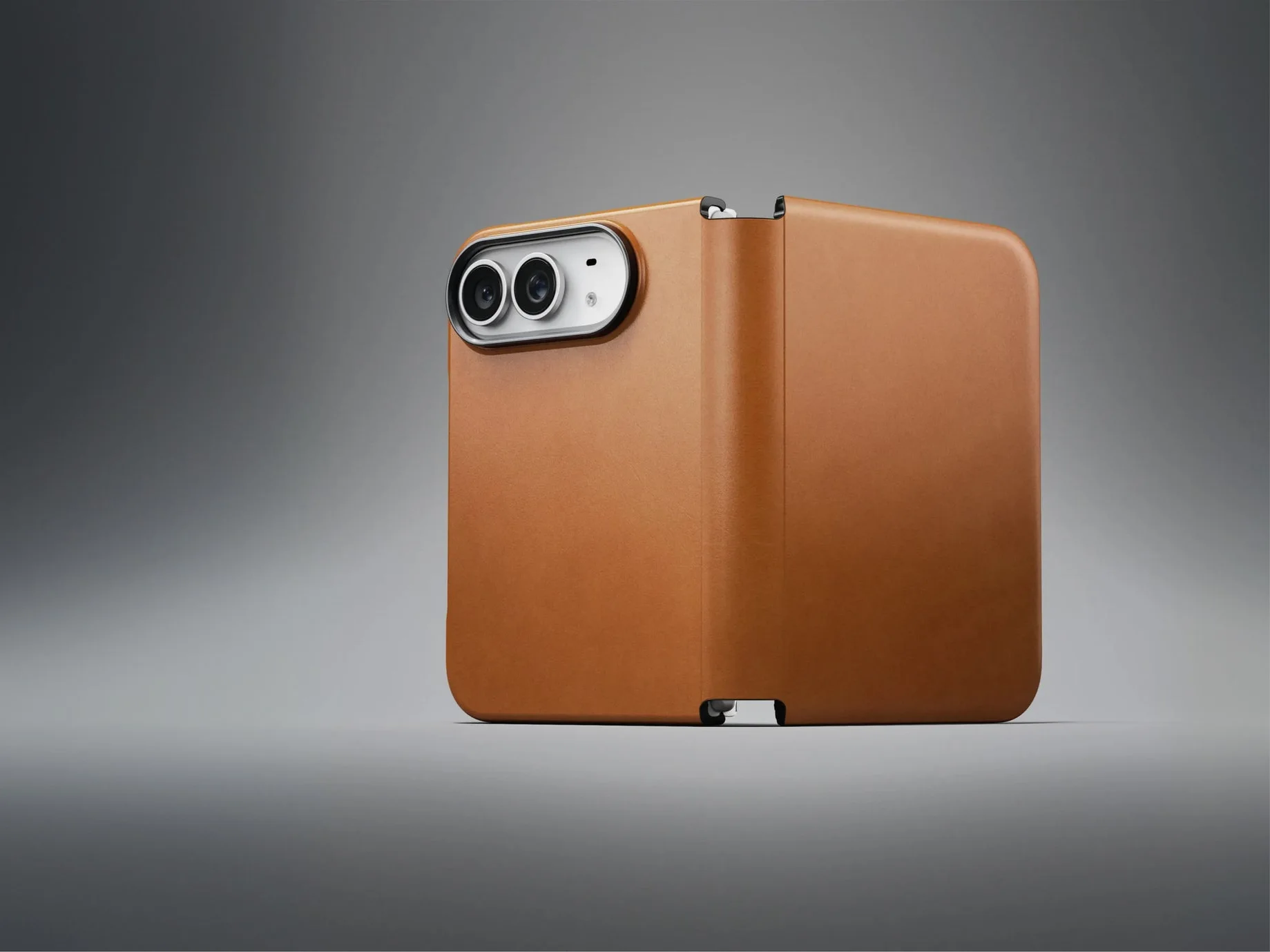 Nomad leather folio case in tan, standing open on a grey backdrop