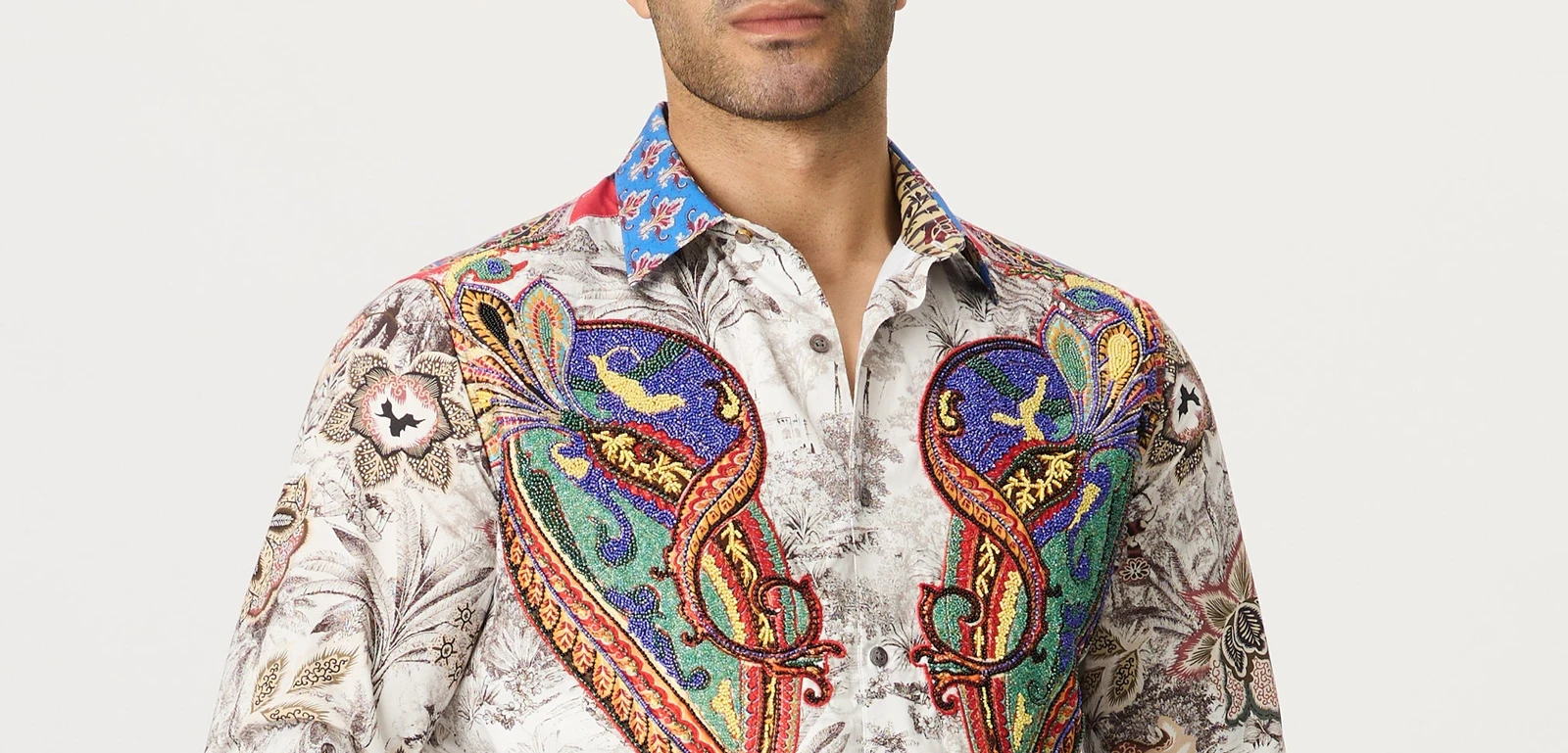 Close-up of a Robert Graham shirt with colorful embroidered paisley on a floral print